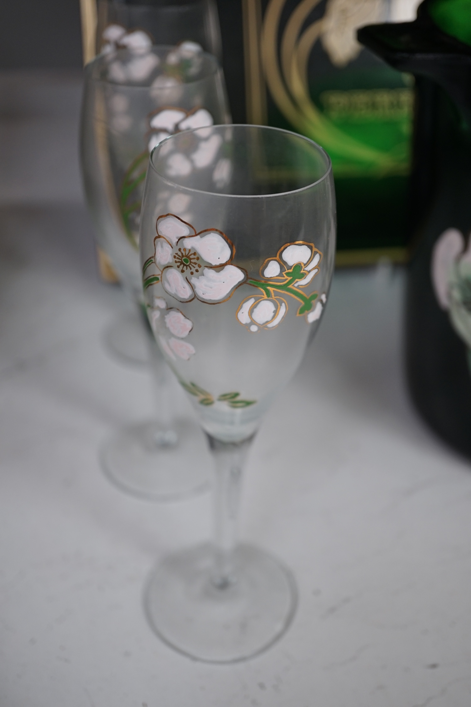 After an Emile Galle design, a Perrier Jouet ‘Belle Epoque’ champagne bucket, seven glass champagne flutes and a tray, largest 48cm wide. Condition - fair.